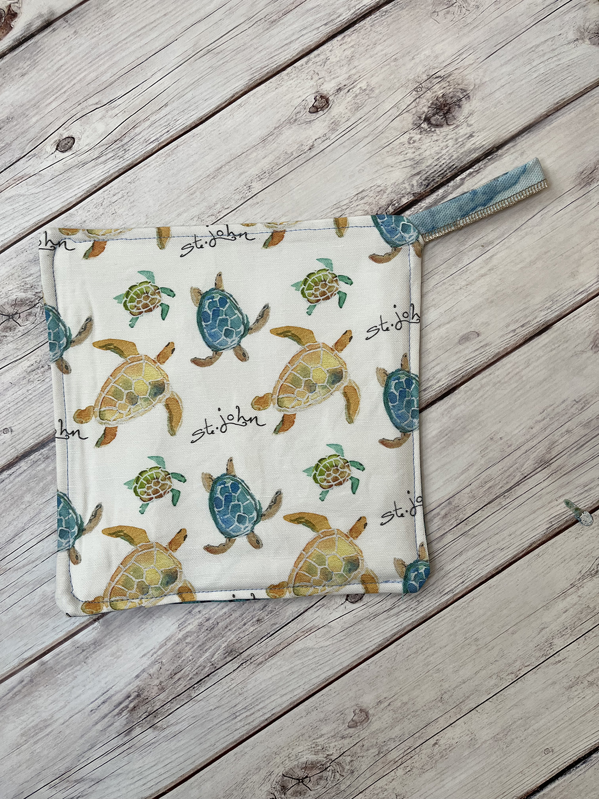 This whimsical sea turtle pattern potholder is a favorite for all St. John lovers! The unique design will bring island charm to your kitchen.